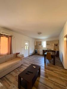 a living room with a couch and a table at UnaMar 2 in Prčanj