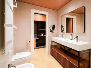 a bathroom with a sink and a mirror at Best Western Hotel Arya in Sirmione