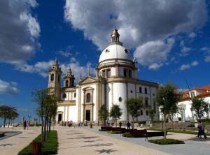 a large white building with a tower on top of it at Hotel João Paulo II in Braga