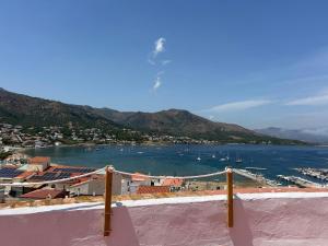 a view of a city and a body of water at Hostal Boutique Es Grop in Port de la Selva