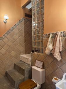 a bathroom with a toilet and a sink at Casa Ana in Monóvar +33 photos