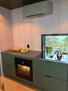 a kitchen with a counter and an oven at Brennvika Panorama in Hamarøya +14 photos