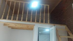 a light above a door in a room at Jonson in Poti