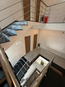 an overhead view of a staircase in a building at Misty Suite Infopark in Cochin