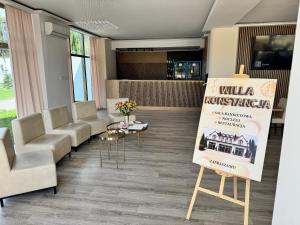 a waiting room with a sign in a building at Willa Konstancja in Aleksandrów Łódzki