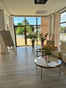 a living room with a couch and a table at Willa Konstancja in Aleksandrów Łódzki +6 photos