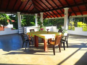 a table and chairs sitting on a patio at Villa Nadika in Beruwala