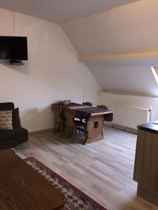 TV a/nebo společenská místnost v ubytování Appartements Bon Secours