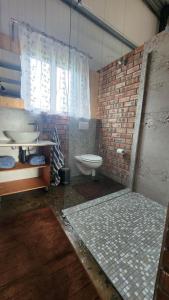 a bathroom with a sink and a toilet at Kairos Vista in Sedgefield