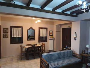 a living room with a couch and a table at Villa near Ierissos in Ierissos