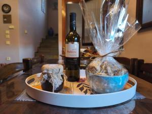 a bottle of wine sitting on a table at Villa near Ierissos in Ierissos