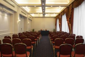 an empty room with chairs and a stage at Grand Hotel Sitea in Turin