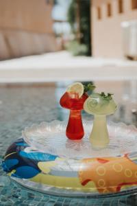 a tray with two vases sitting on a table at DUNIA Desert Suites in Mitzpe Ramon