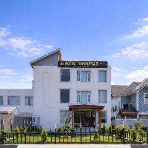 a hotel town star building with a sign on it at Hotel Town Star in Srinagar