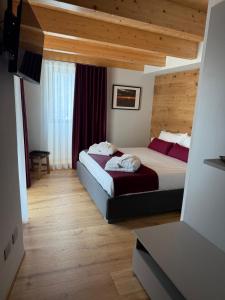 a bedroom with two beds in a room at Adamello skyline in Temù