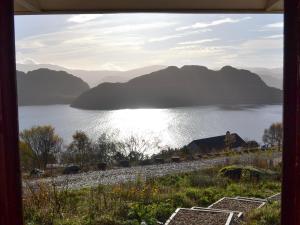 a view of a lake with mountains in the background at Mango Pony's Bothy - Uk31959 in Dibaig