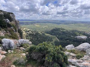 a view from the top of a mountain with rocks at Galilee Nook in Kefar Weradim +5 photos