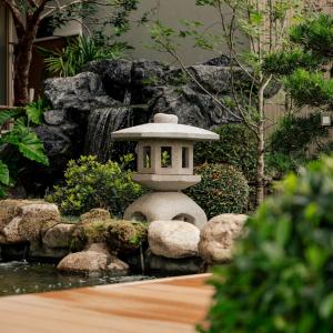 a japanese garden with a pagoda in the middle at Zen Essence Khao Yai in Khao Yai