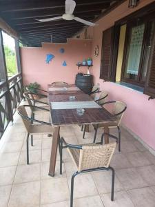 a wooden table and chairs on a patio at Villa near Ierissos in Ierissos