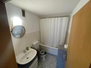 a small bathroom with a sink and a mirror at Unterkunft in Stadtnähe in Gütersloh