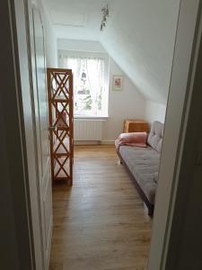 a living room with a couch and a ladder at Haus Berta in Spremberg
