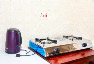 a toaster and a toaster sitting on a counter at Comfort Inn Nyeri in Nyeri