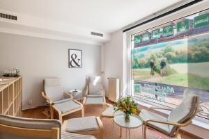 a waiting room with chairs and a large window at Pension in Malchin in Malchin
