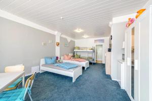 a living room with a couch and a table at Pension in Malchin in Malchin +70 photos