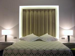 Postel nebo postele na pokoji v ubytování Hotel Palacio Albacete & SPA