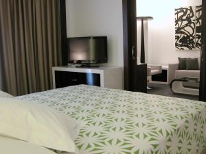 Postel nebo postele na pokoji v ubytování Hotel Palacio Albacete & SPA