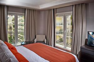 Postel nebo postele na pokoji v ubytování Carles Hotel