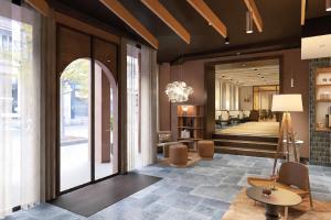 a lobby with a living room and a hallway at Hôtel de l'Europe by HappyCulture in Strasbourg +74 photos
