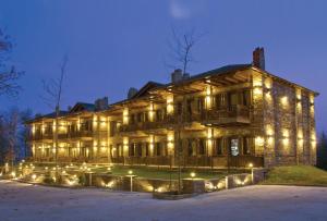 a large building with lights on it at night at Thermes Pozar Resort in Kato Loutraki
