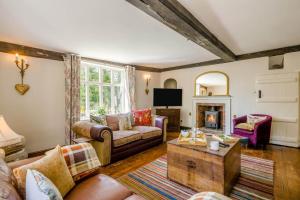 a living room with a couch and a fireplace at 6 Bed in Norwich oc-42594 in Shelton