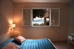 מיטה או מיטות בחדר ב-Résidence Ogliastrello