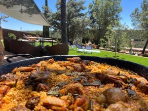 a dish of food in a pan on a table at Refugio Bella Luna in Ruidera