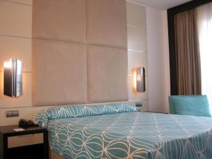Postel nebo postele na pokoji v ubytování Hotel Palacio Albacete & SPA