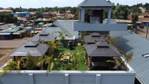 an overhead view of a house with a person standing in the yard at Saffron Inn Luxury Hotel in Marsabit
