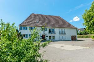 a large white house with a brown roof at Gästehaus Schwert in Salem