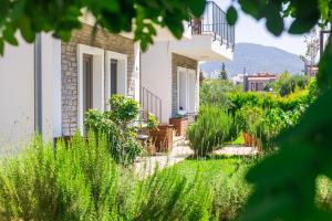 a house with a garden in front of it at Kargı Suites Datça in Datca