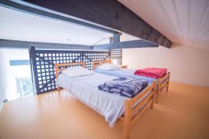 Postel nebo postele na pokoji v ubytování Appartements Les Déferlantes Mimizan-plage + 38 fotografií