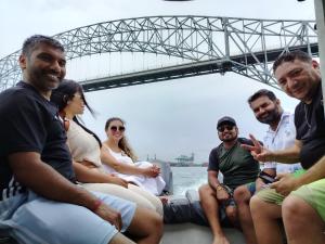 a group of people sitting on a boat in the water at Tour Full Day Taboga in Panama City