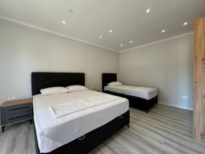 a bedroom with two beds in a room at Paradise Luxury in Ulcinj