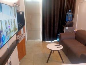 a living room with a couch and a table at Tsavo in Nairobi