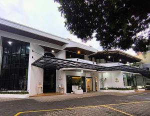 a large white building with a lot of windows at Tamashii Boutique Hotel in Bandung
