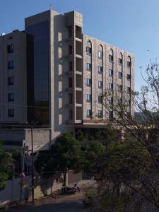 a large building in front of a building at Centre Point Amravati in Amrāvati +15 photos