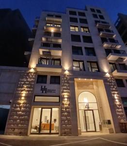 a hotel with a lit up facade at night at Hematian Hotel by Effy in Jerusalem