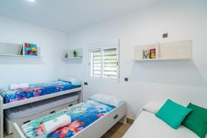 a bedroom with two bunk beds and a window at Cubo's Maipa Rural House in Loja +37 photos