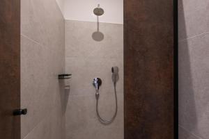 a shower with a phone in a bathroom at Porton Nature Hideouts Pitches in Rovinj