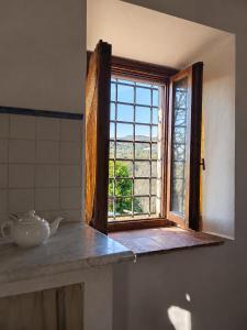 an open window in a kitchen with a counter top at Agriturismo Cocò in Lamporecchio
